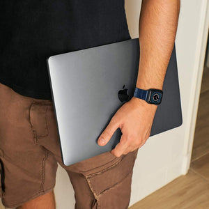 man with blue cocodirle band for apple watch